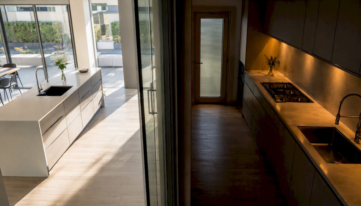 Comparison of open and closed kitchen spaces showing light differences