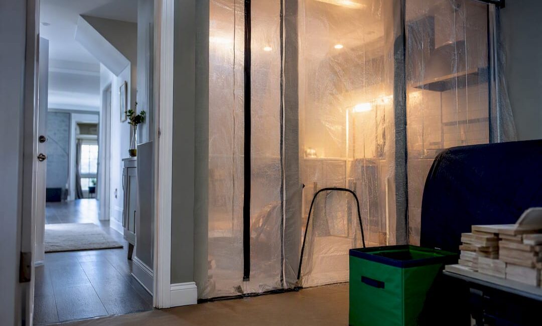 Sealed renovation zone beside clean living area
