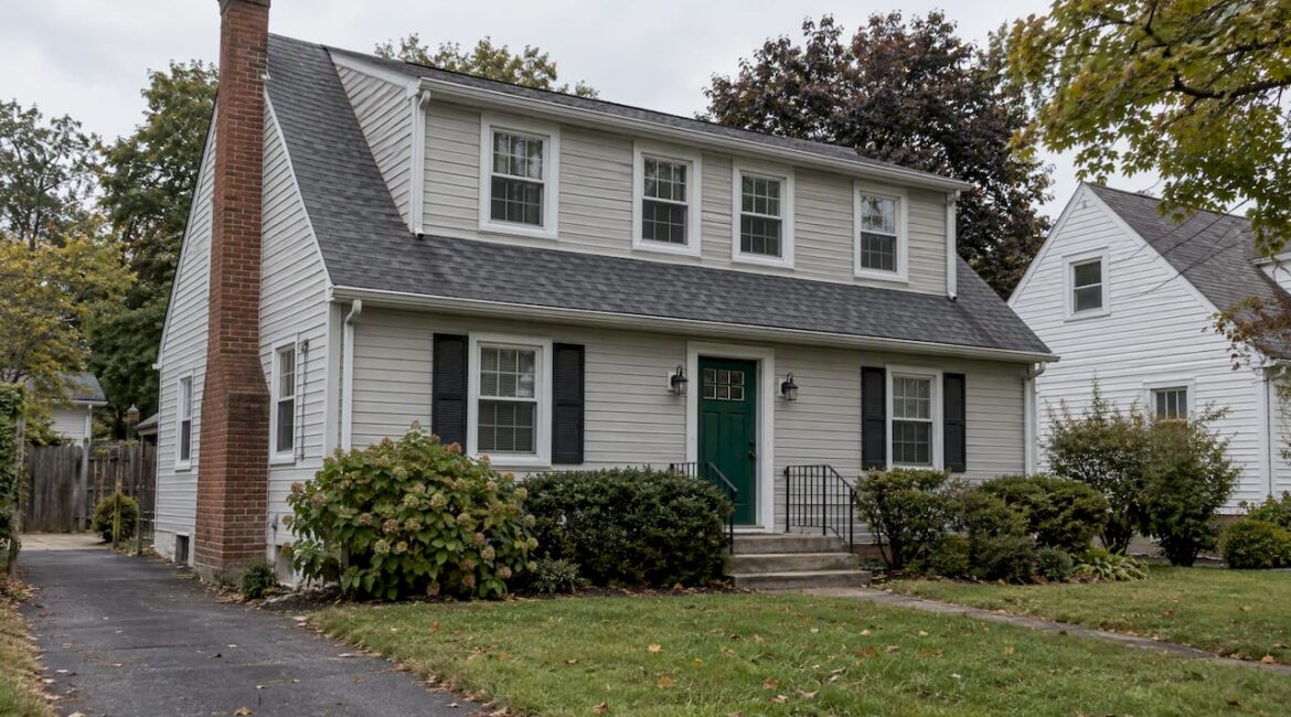 Cape Cod home with a broad shed dormer