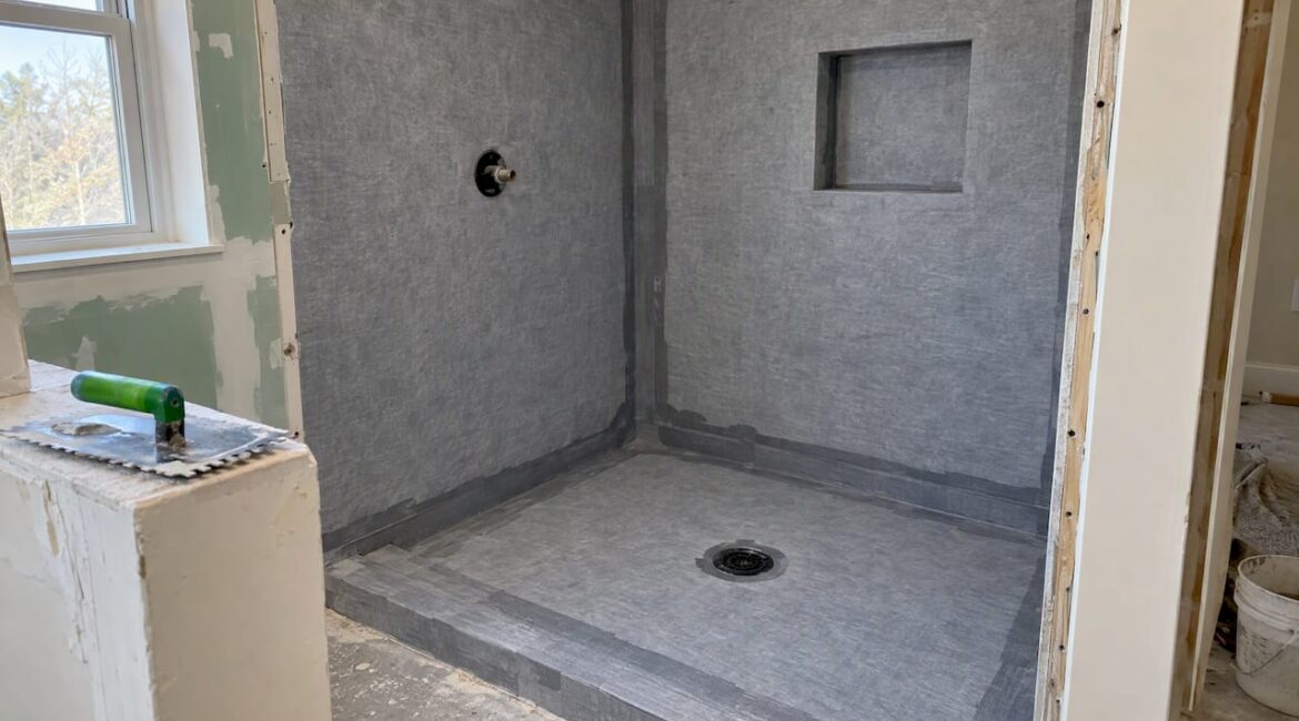 Waterproof membrane installed across a shower