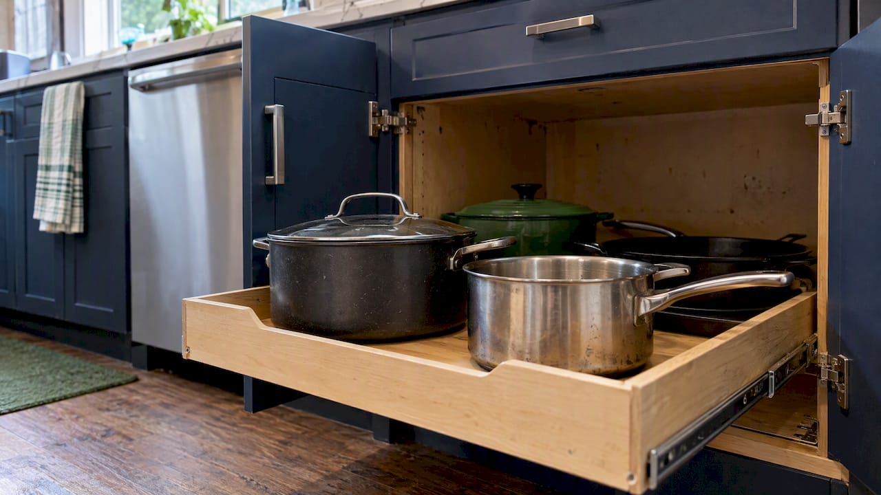 Cookware on an extended base cabinet shelf