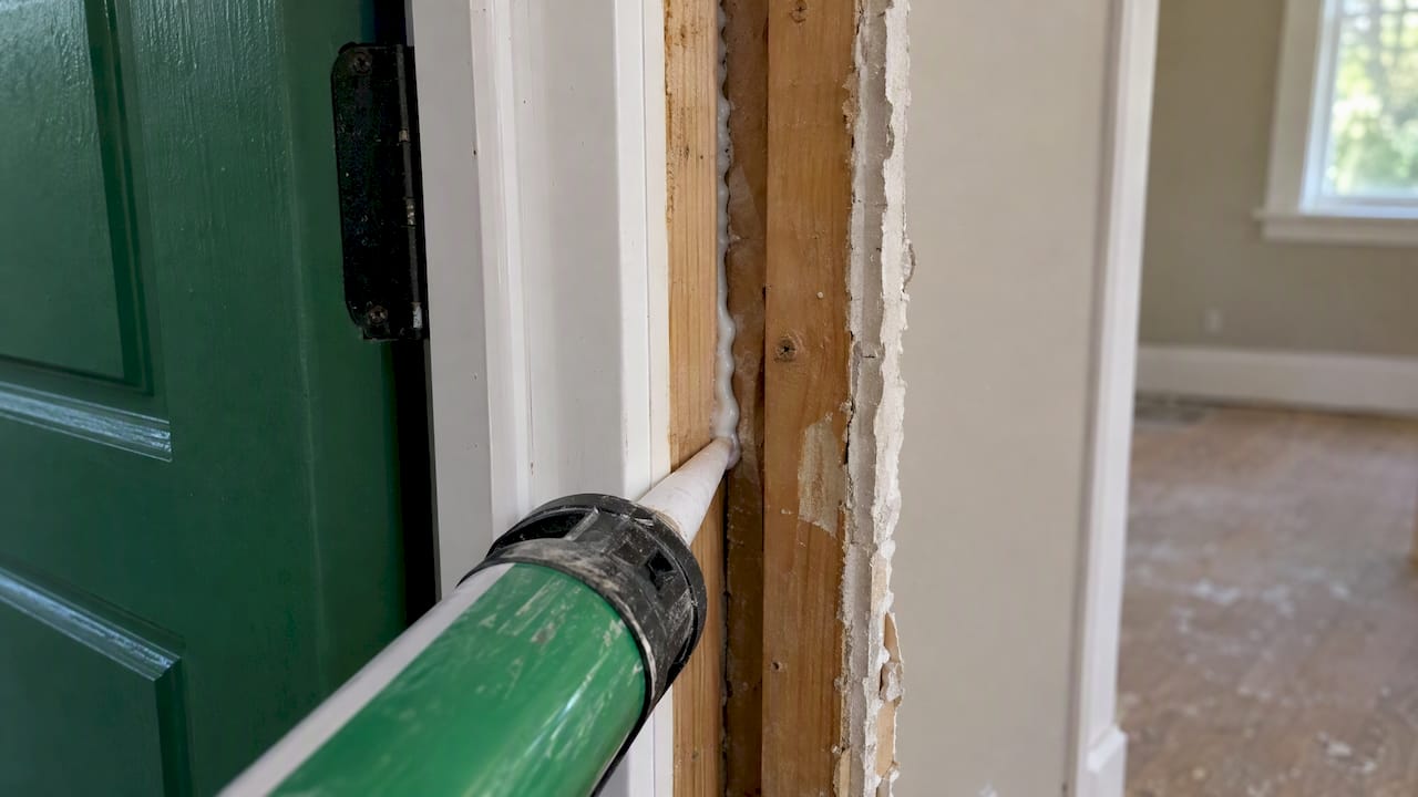 Open trim reveals sealed jamb framing gap